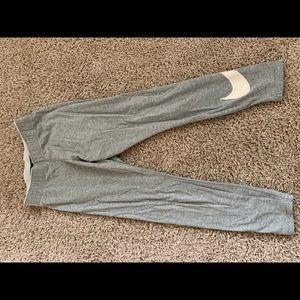 Women’s gray 3/4 length yoga pants with band.